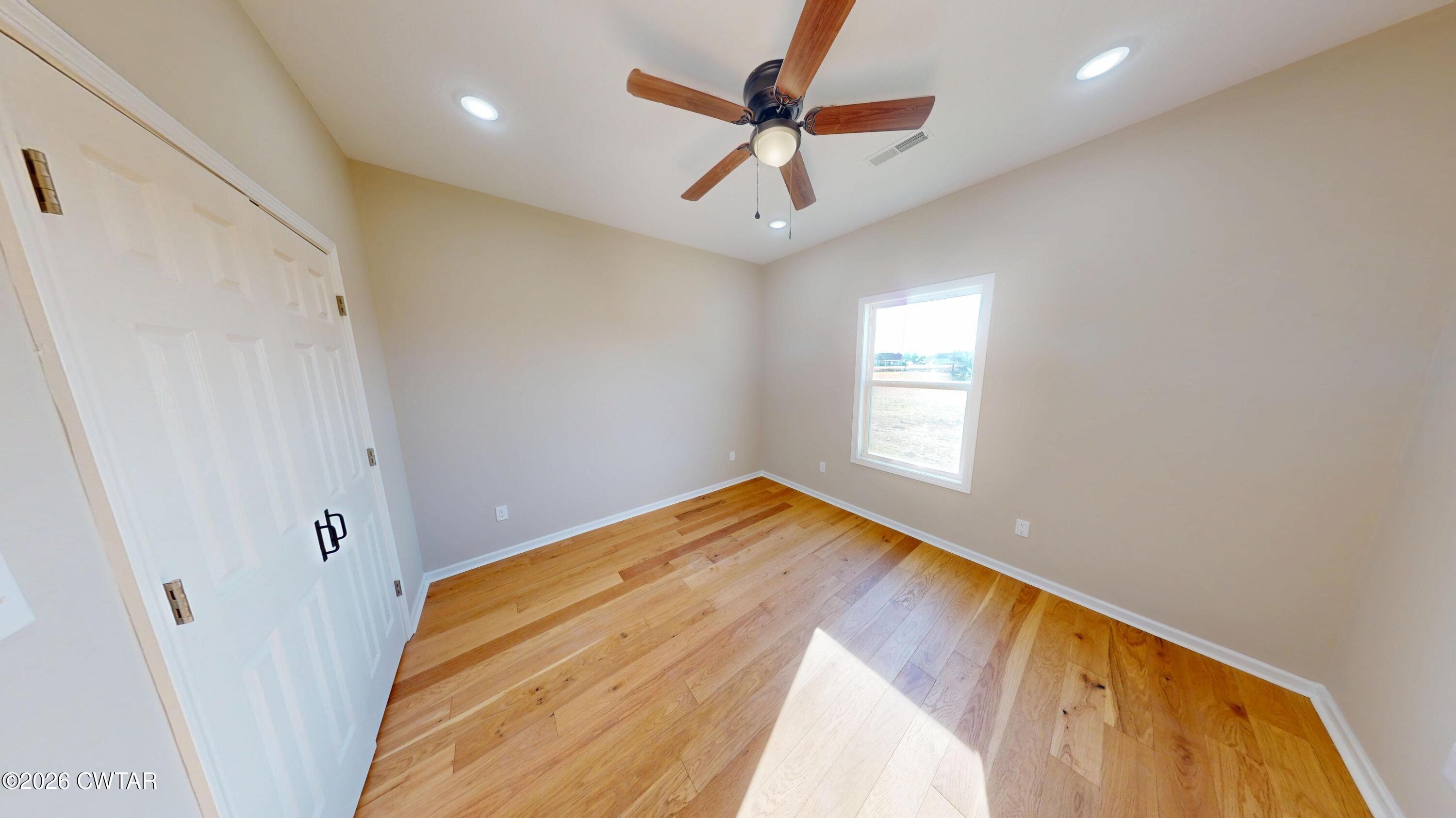 1360 Bonicord Road Dyersburg, TN 38024 - Photo 21 of 31 a view of empty room with wooden floor