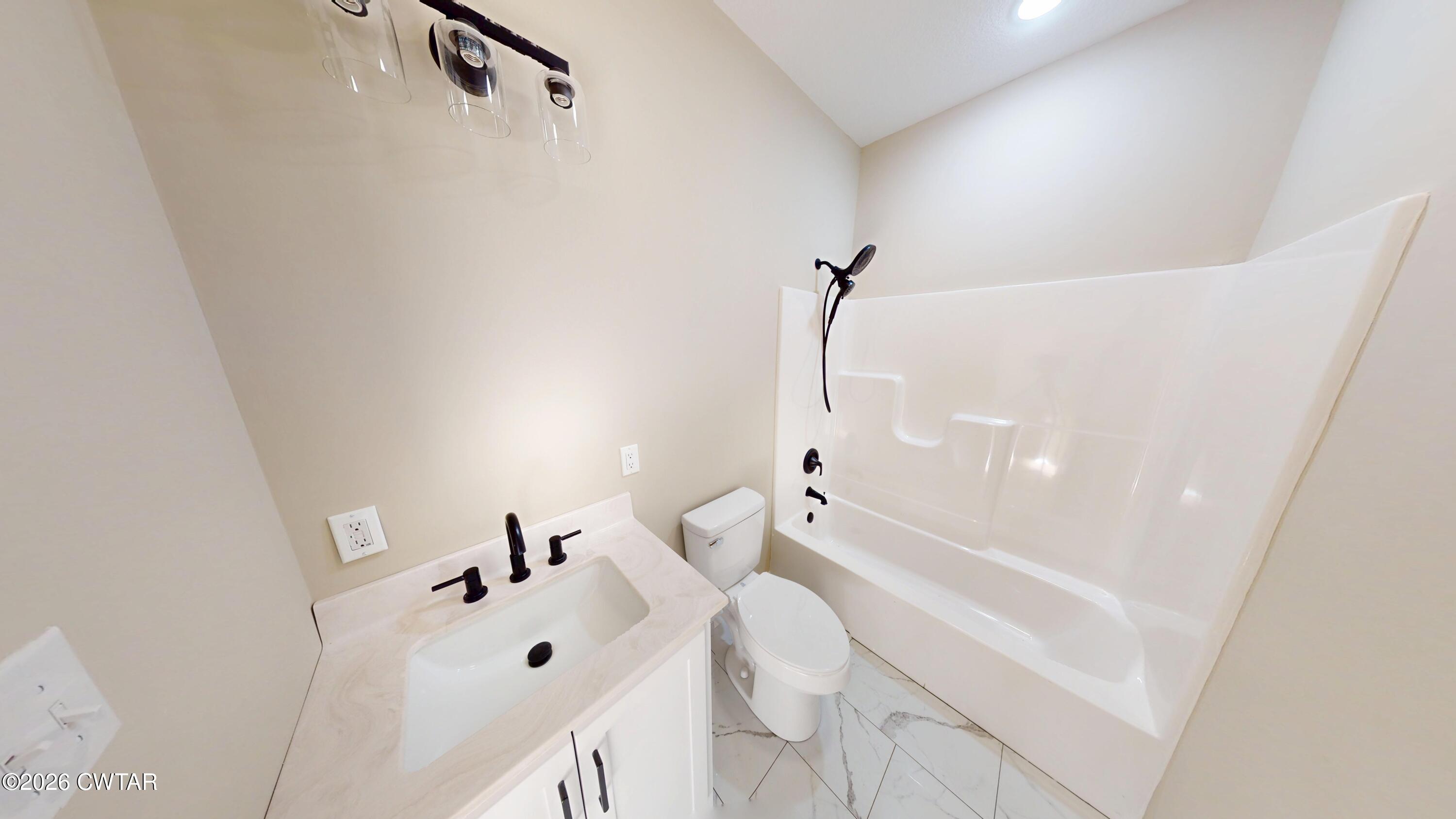 1360 Bonicord Road Dyersburg, TN 38024 - Photo 23 of 31 a bathroom with a bathtub and shower