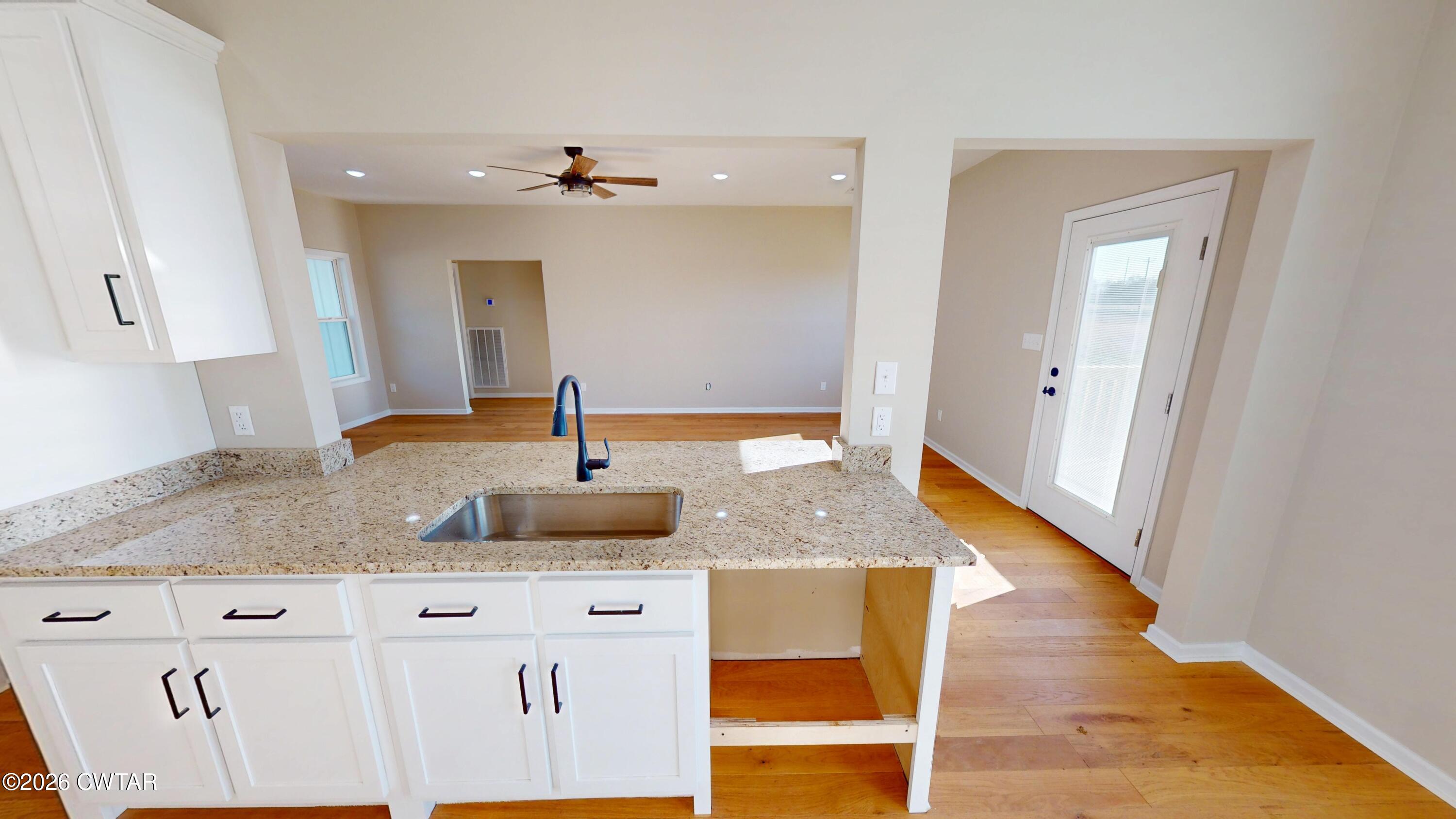 1360 Bonicord Road Dyersburg, TN 38024 - Photo 10 of 31 a bathroom with a granite countertop sink
