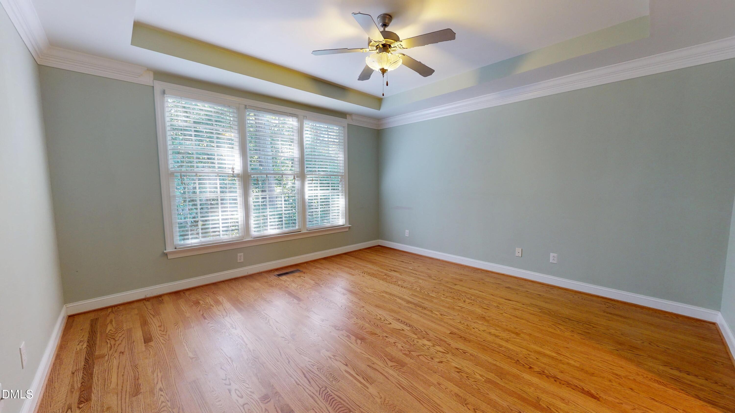 119 Yorkchester Way Raleigh, NC 27615 - Photo 54 of 76 a view of an empty room with a window and wooden floor