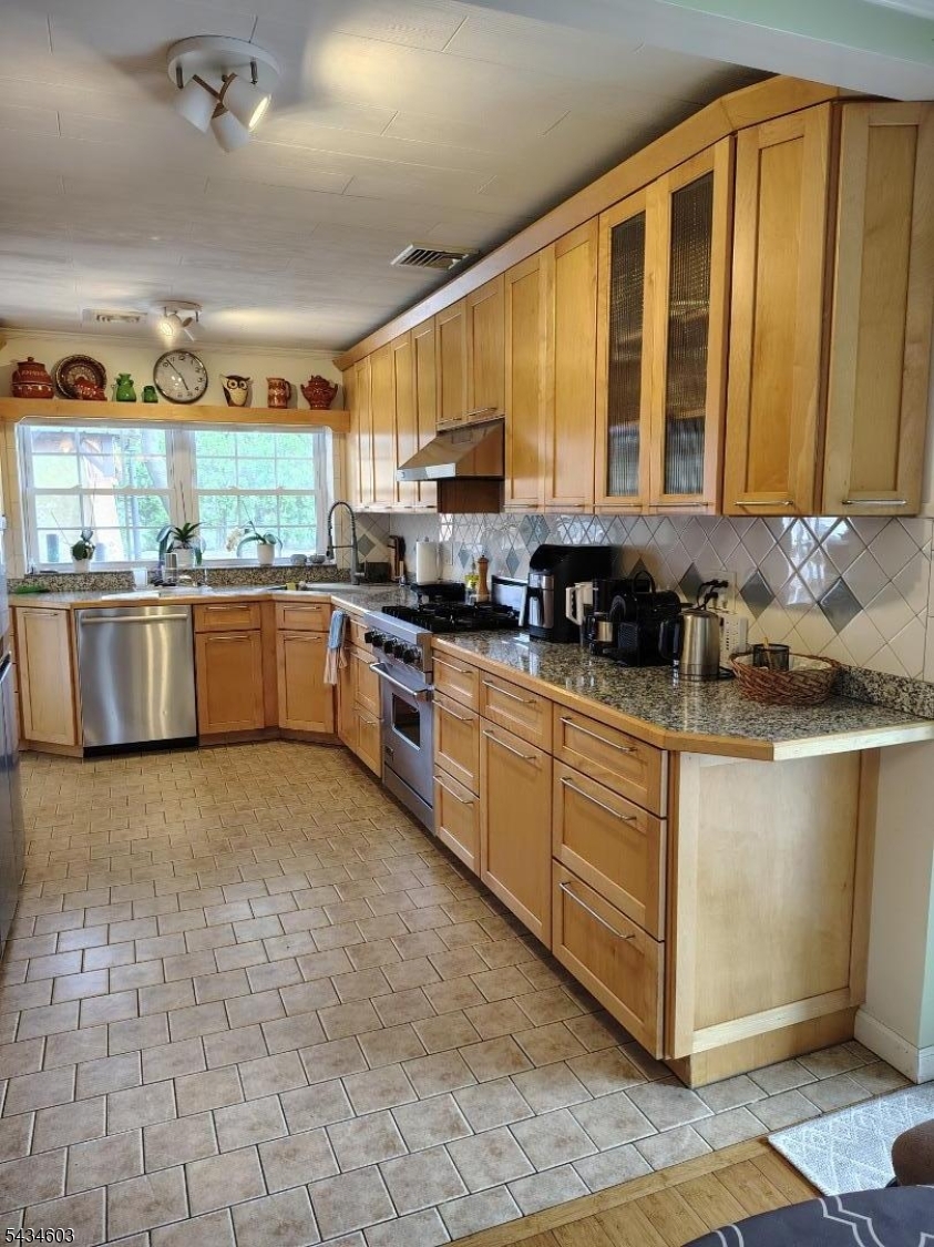 442 River Road North Arlington, NJ 07031 - Photo 6 of 26 a kitchen with stainless steel appliances granite countertop a sink stove and cabinets