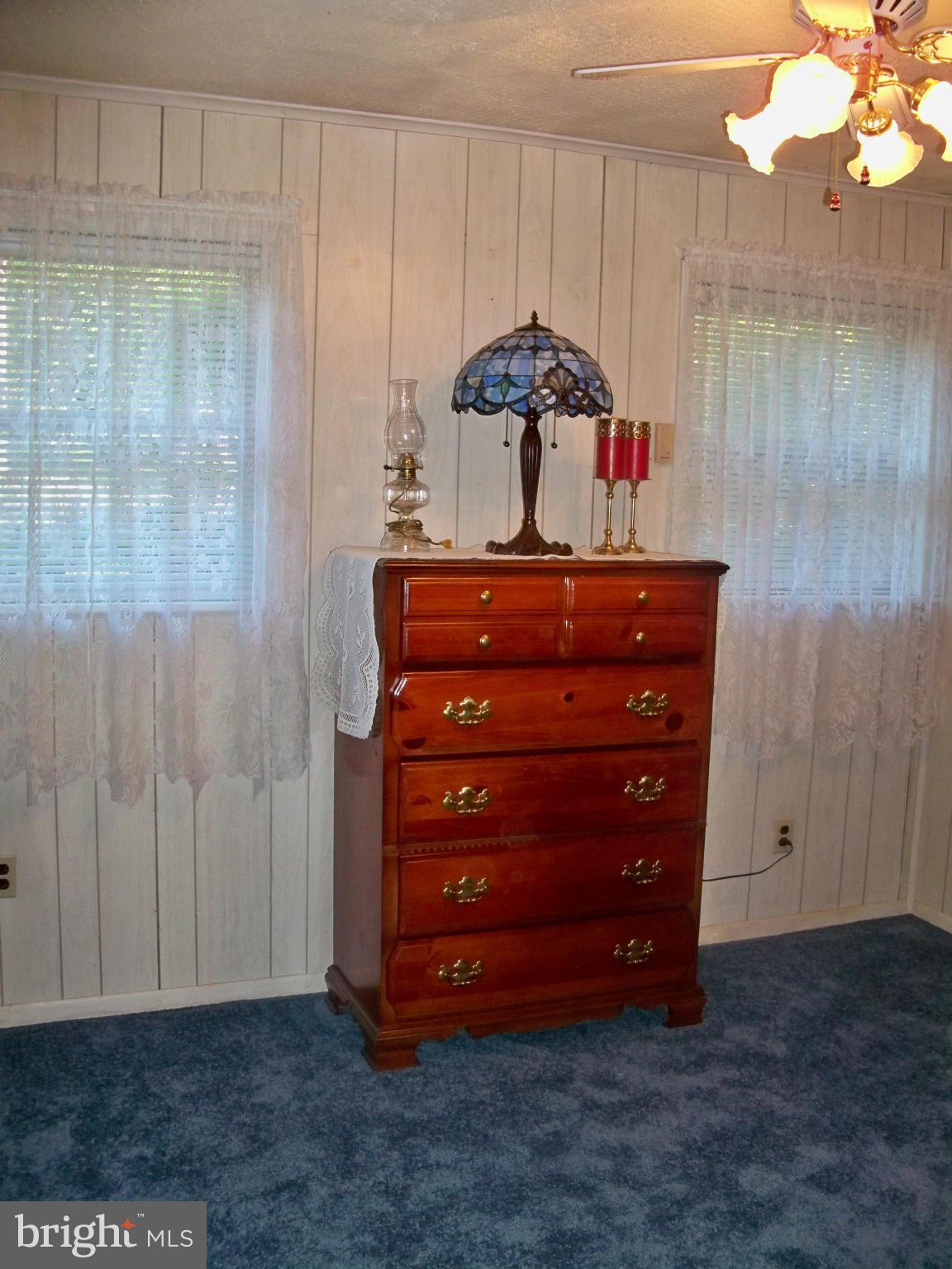 160 Almost Heaven Road Falling Waters, WV 25419 - Photo 17 of 30 a room with a dresser and a mirror