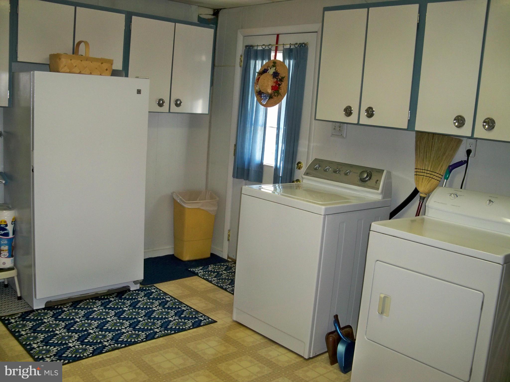 160 Almost Heaven Road Falling Waters, WV 25419 - Photo 18 of 30 a room with dryer and washer