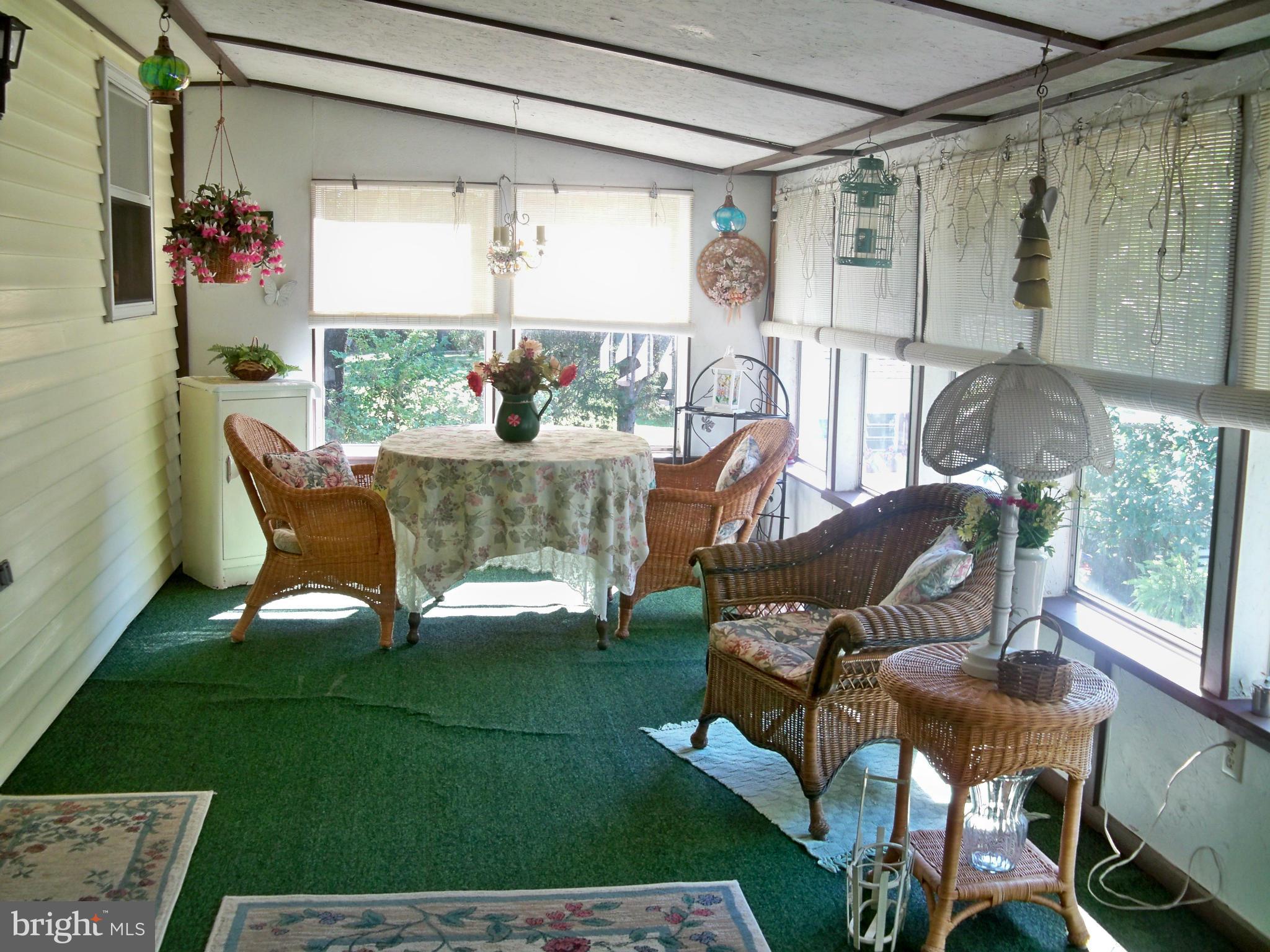 160 Almost Heaven Road Falling Waters, WV 25419 - Photo 23 of 30 a view of a porch with chairs and backyard