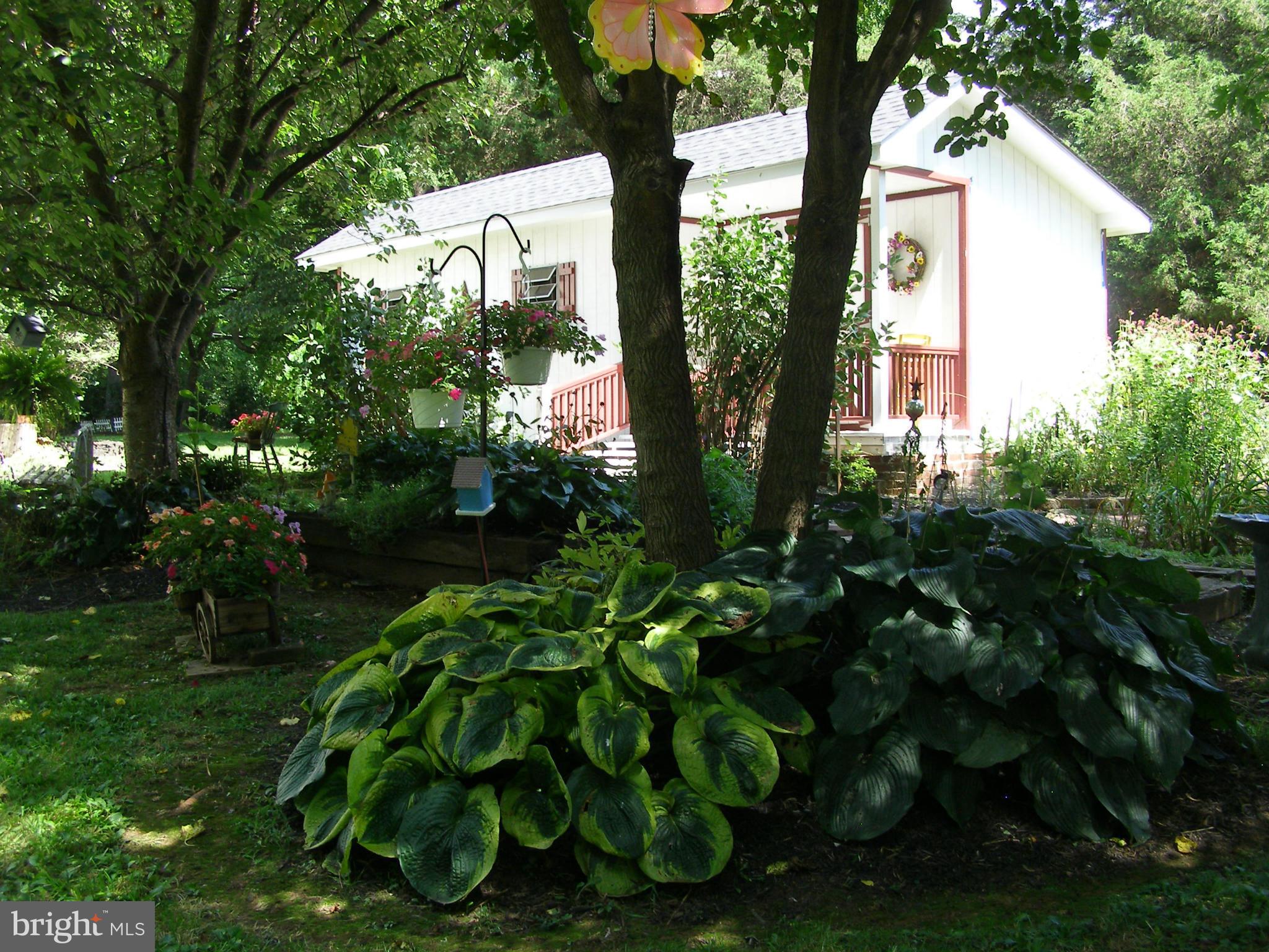 160 Almost Heaven Road Falling Waters, WV 25419 - Photo 6 of 30 a backyard of a house with lots of green space