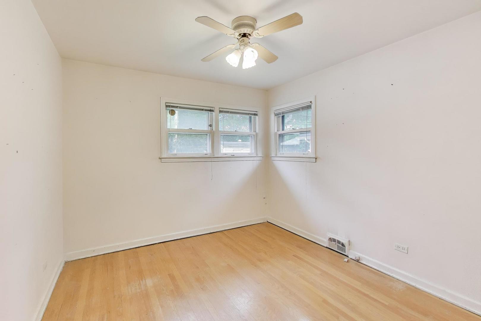 507 North Hamlin Avenue Park Ridge, IL 60068 - Photo 16 of 30 an empty room with windows and fan