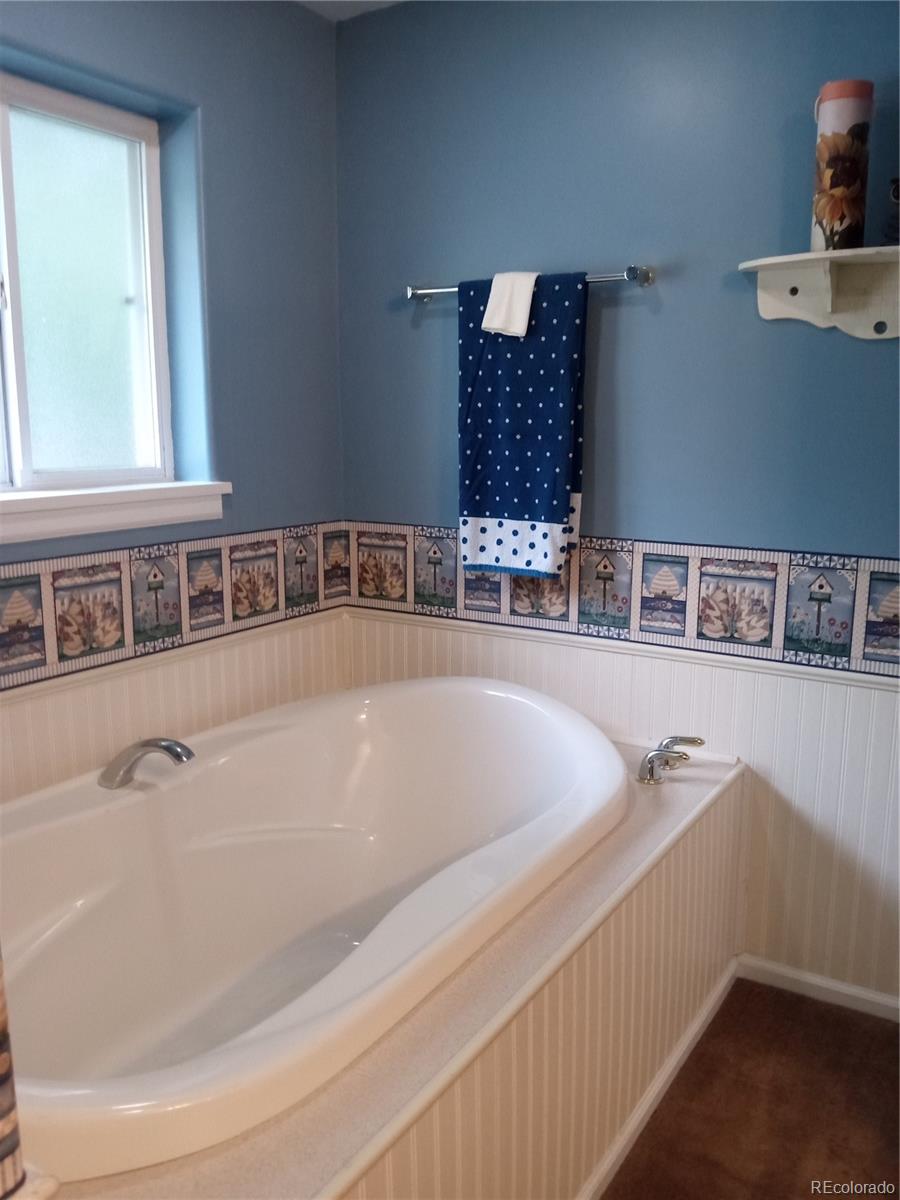 7150 South Platte Canyon Road Littleton, CO 80128 - Photo 14 of 37 a bathroom with a tub and sink