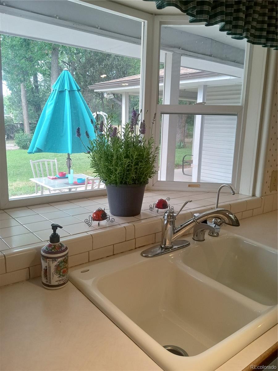 7150 South Platte Canyon Road Littleton, CO 80128 - Photo 28 of 37 a bath tub sitting in front of a window