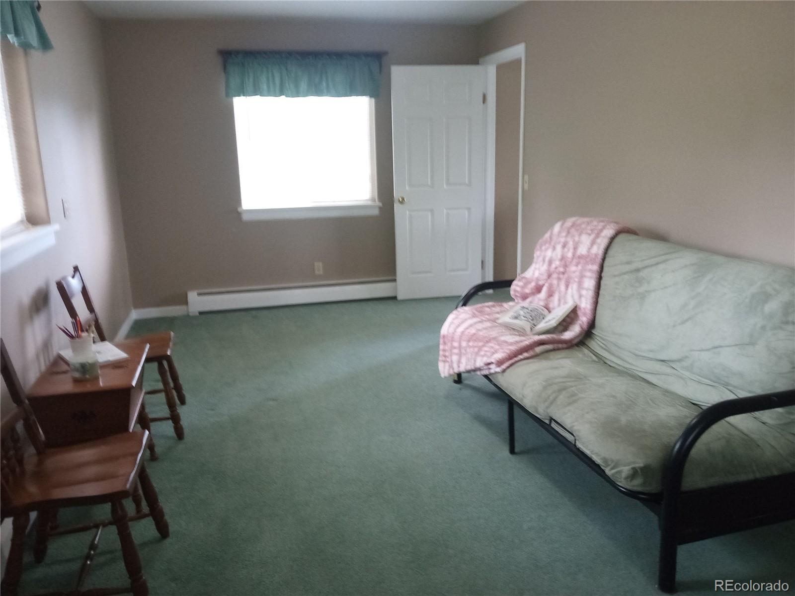 7150 South Platte Canyon Road Littleton, CO 80128 - Photo 30 of 37 a living room with furniture and a window
