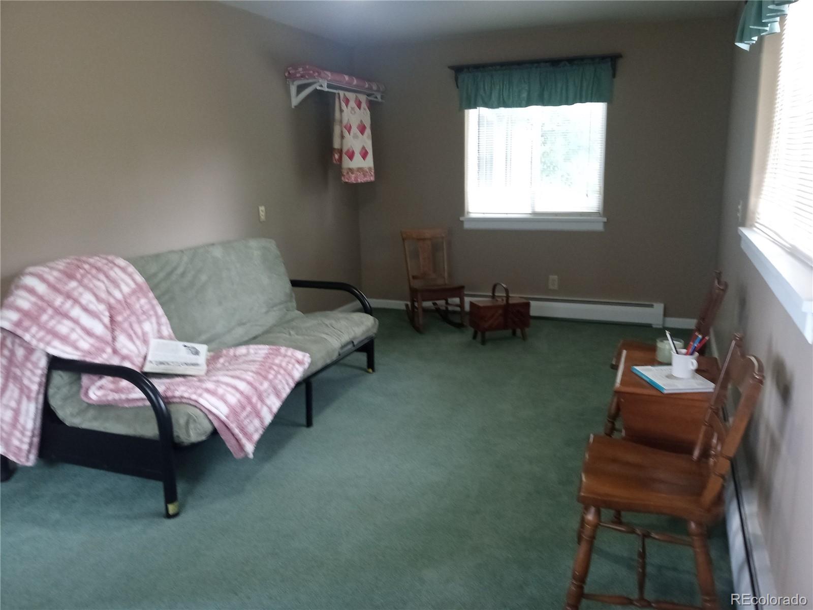 7150 South Platte Canyon Road Littleton, CO 80128 - Photo 31 of 37 a living room with furniture and a window