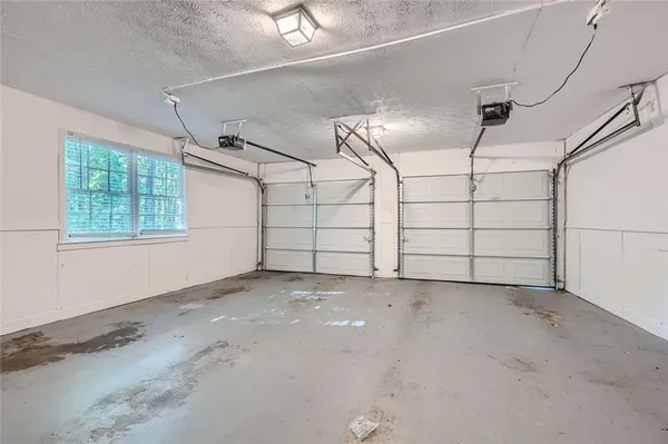 a view of a backyard with large trees