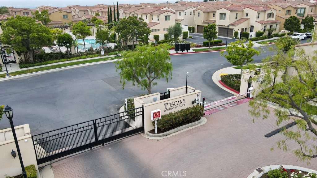 20317 Livorno Porter Ranch Porter Ranch, CA 91326 - Photo 32 of 33 an aerial view of residential houses with outdoor space and parking