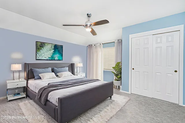 a bedroom with bed and window