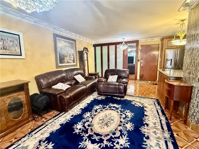 a living room with furniture and a rug
