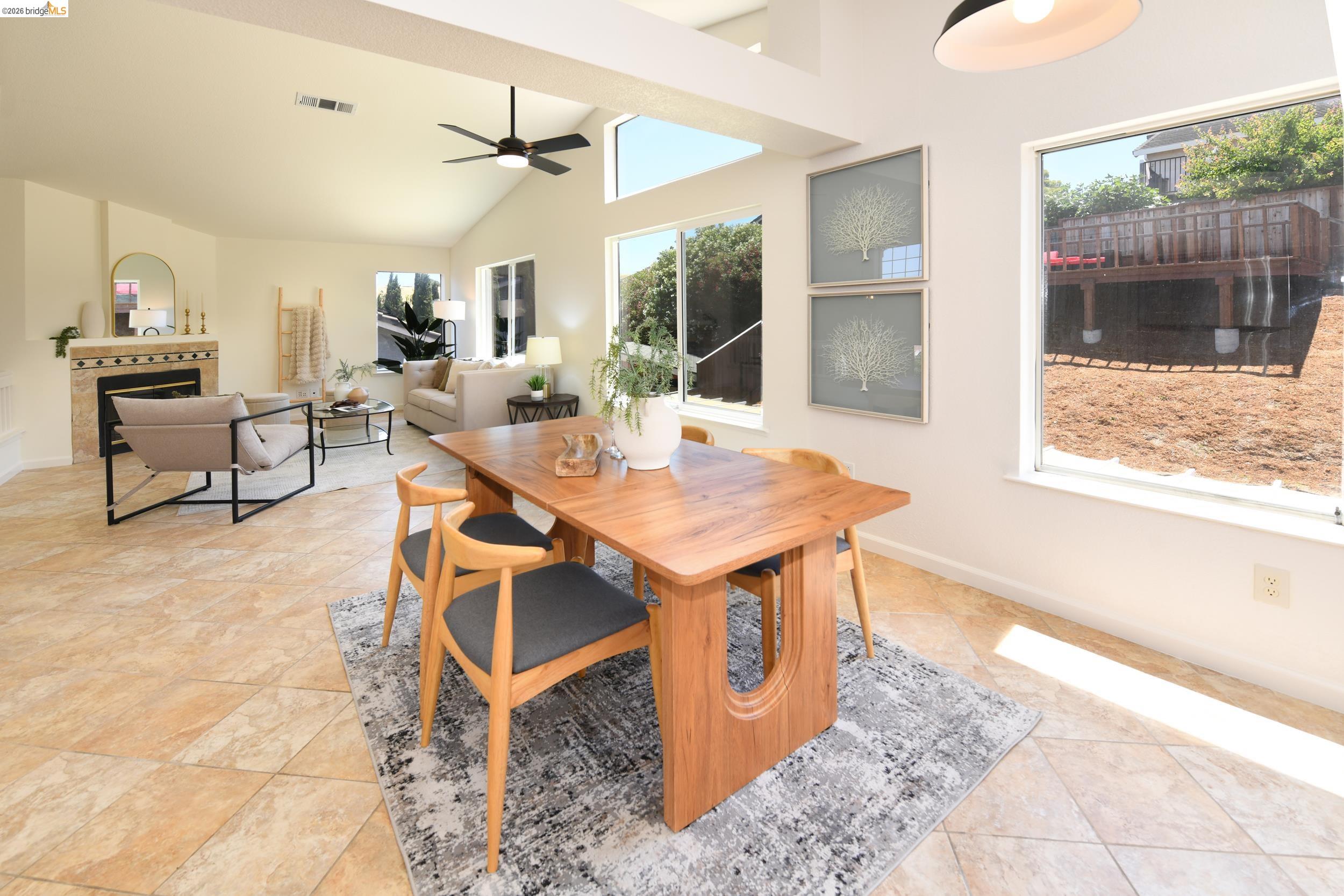 512 Burdick Drive Bay Point, CA 94565 - Photo 20 of 50 Open-concept living space featuring vaulted ceilings, a ceiling fan, and multiple windows