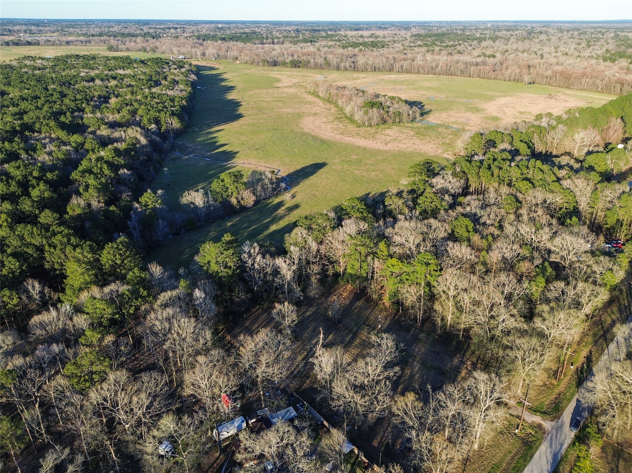 1739 County Road 373 Splendora, TX 77372 - Photo 12 of 12 a view of a lake with a mountain view