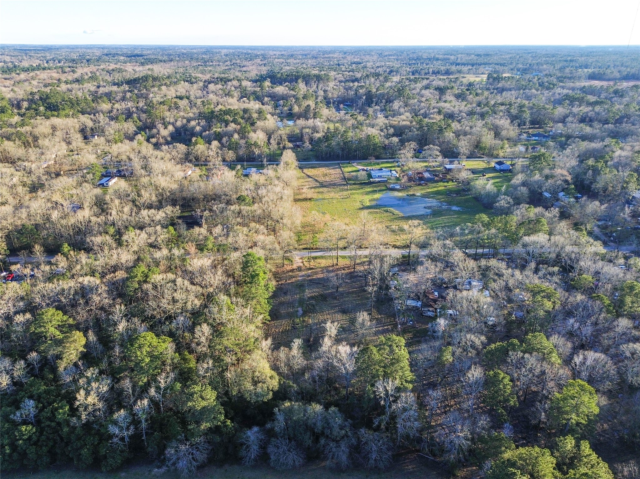 1739 County Road 373 Splendora, TX 77372 - Photo 8 of 12 a view of a lake with mountains in the background