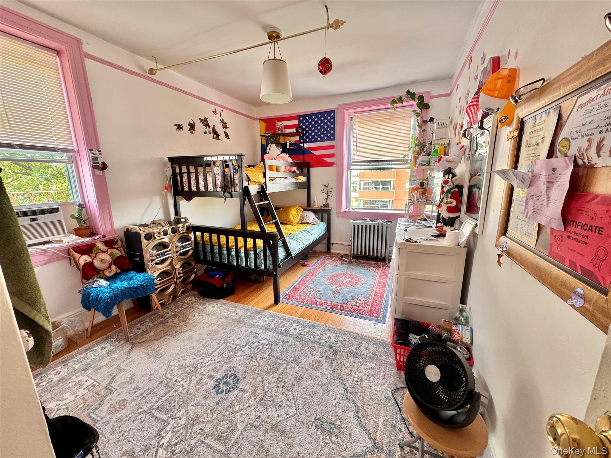 33-54 99th Street Queens, NY 11368 - Photo 14 of 41 a bedroom with furniture and a window