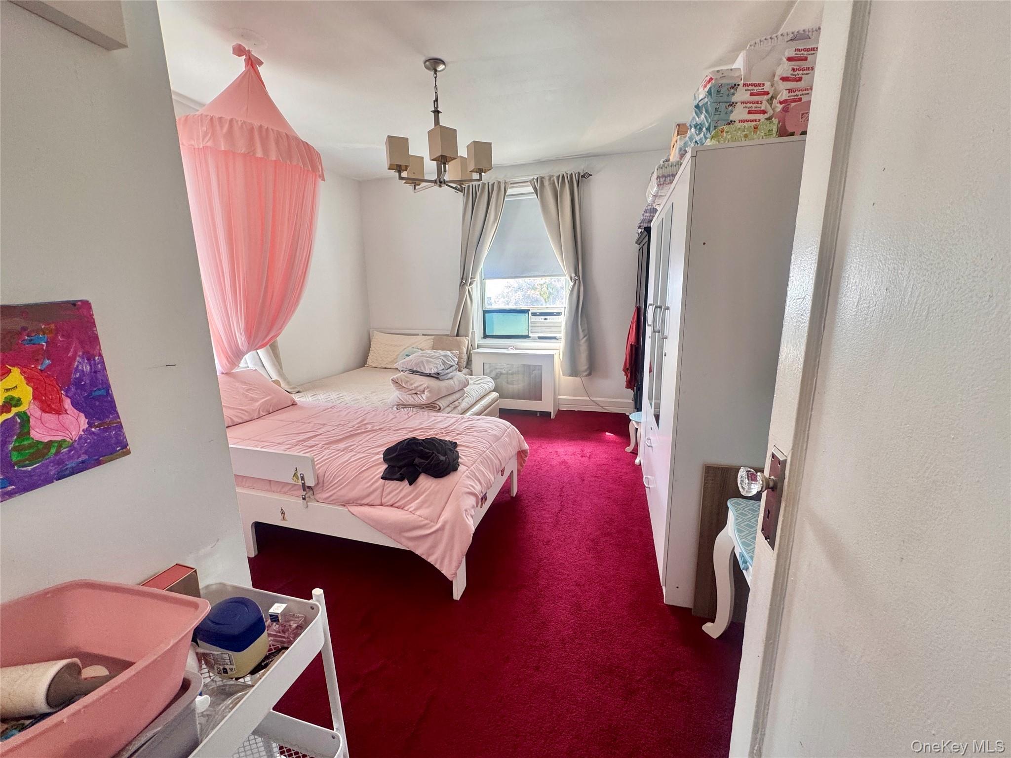 33-54 99th Street Queens, NY 11368 - Photo 34 of 41 a bedroom with a bed and a window