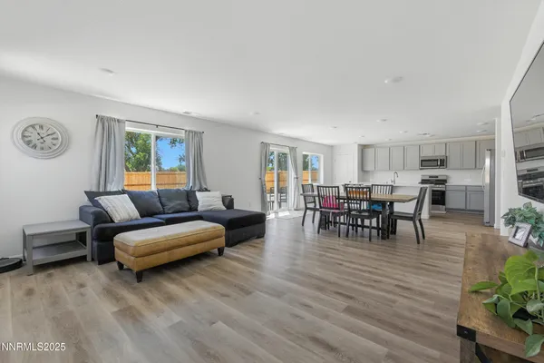 a view of a dining room with furniture window and wooden floor