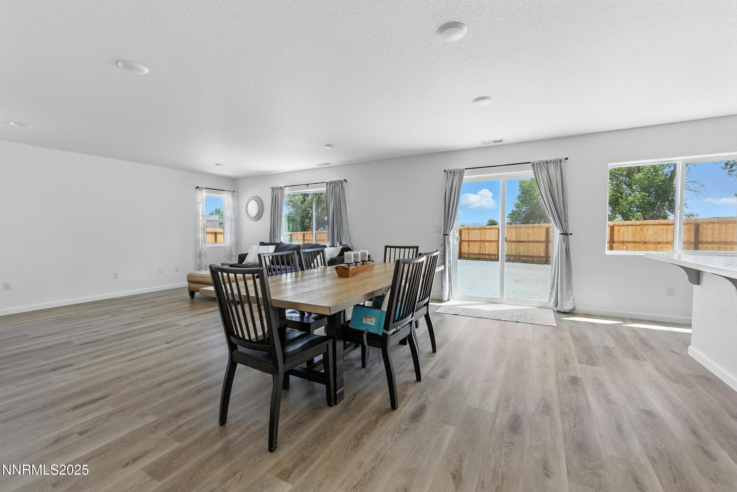 6778 Shell Court Fernley, NV 89408 - Photo 16 of 33 a view of a dining room with furniture window and wooden floor