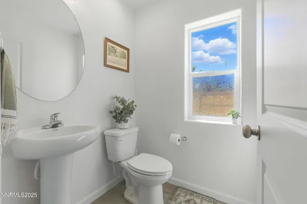 a view of a room with a furniture and mirror