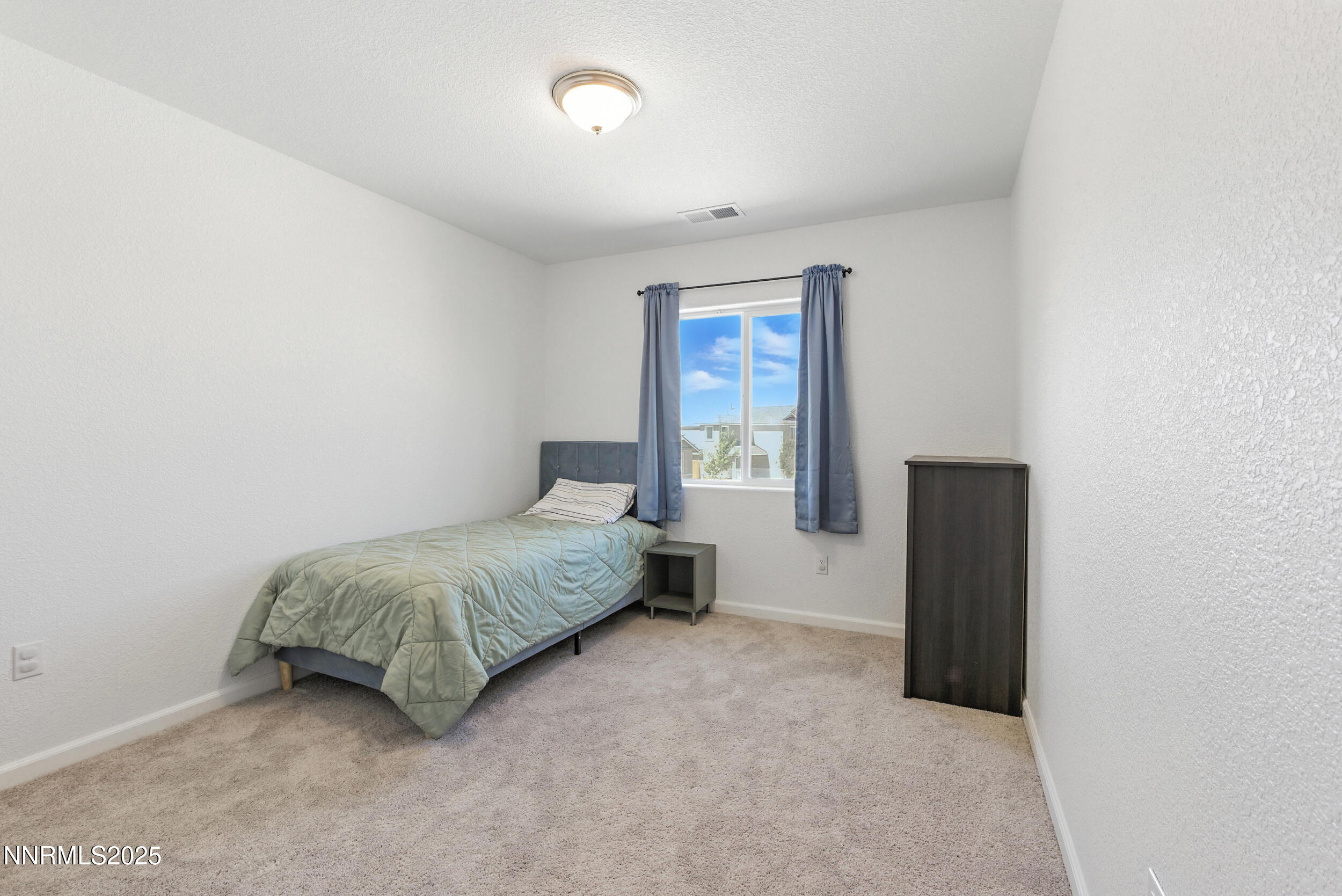 6778 Shell Court Fernley, NV 89408 - Photo 24 of 33 a bedroom with a bed and a window
