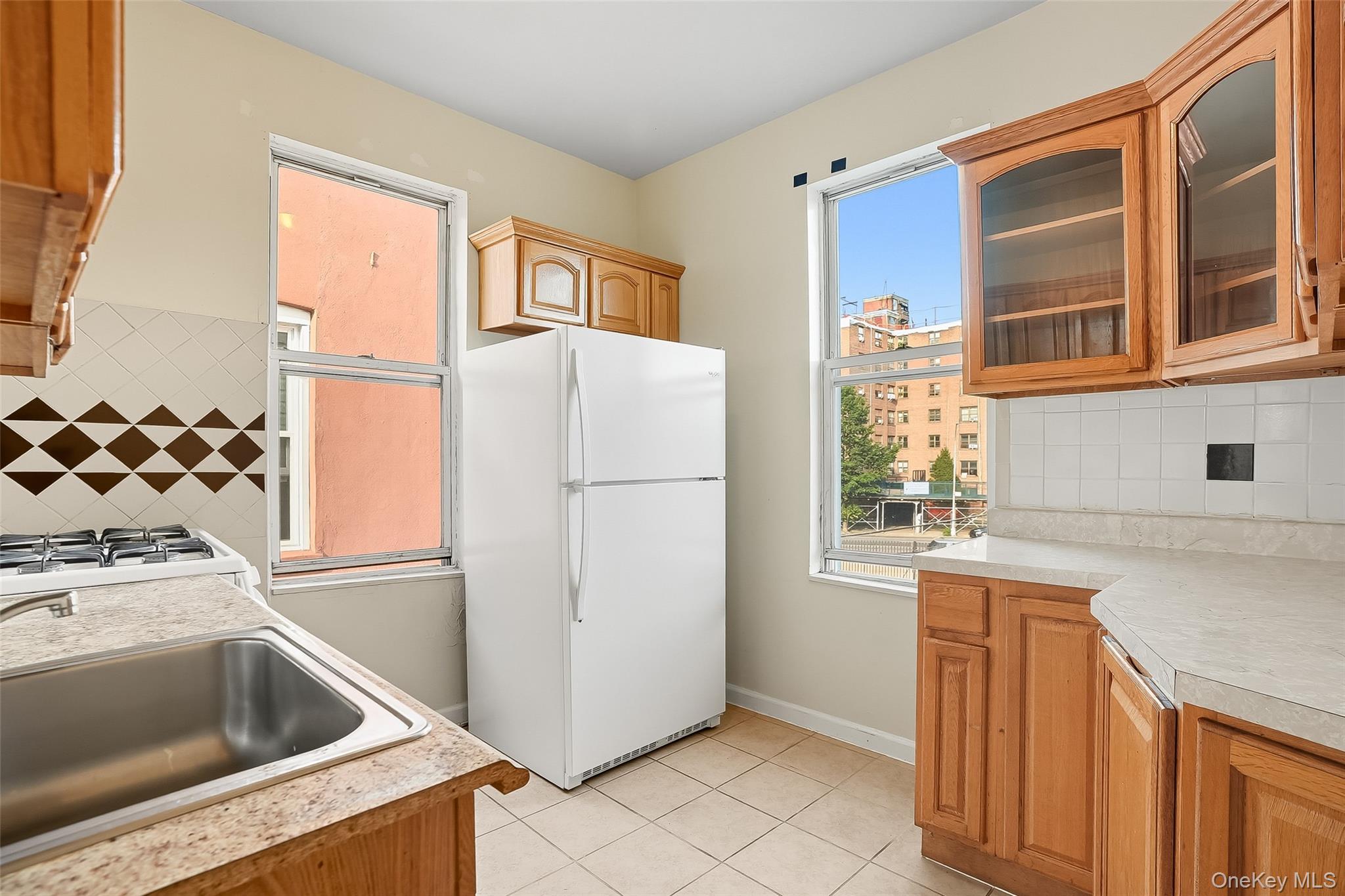 1036 Metcalf Avenue Bronx, NY 10472 - Photo 11 of 26 a kitchen with a refrigerator and a sink