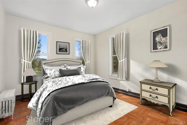 a bedroom with a bed and a night stand