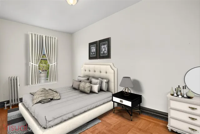 a bedroom with furniture and a window