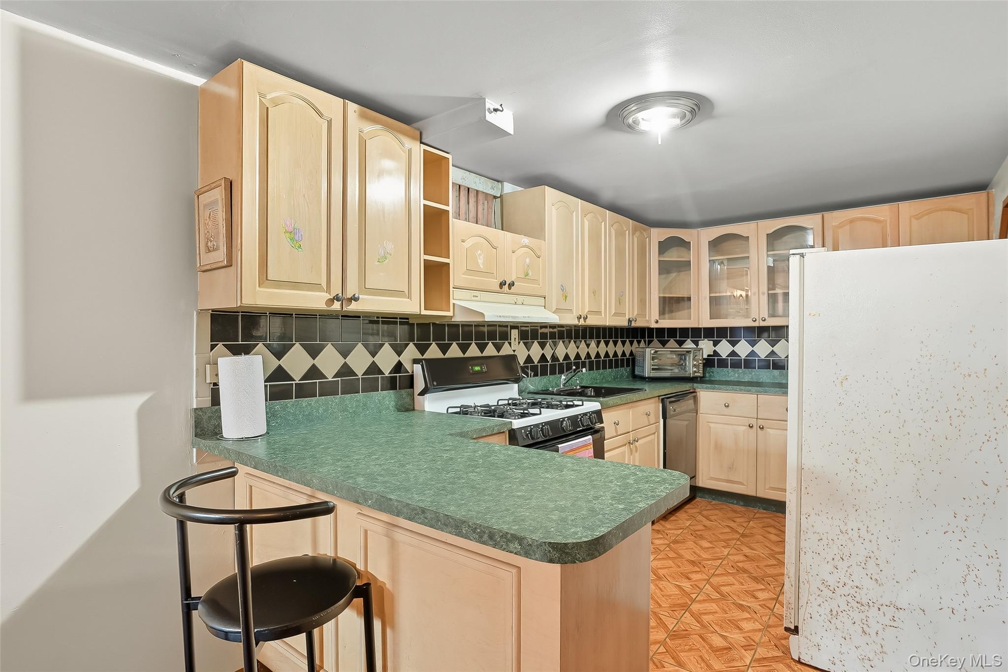 1036 Metcalf Avenue Bronx, NY 10472 - Photo 19 of 26 a kitchen with granite countertop a stove a sink and a refrigerator