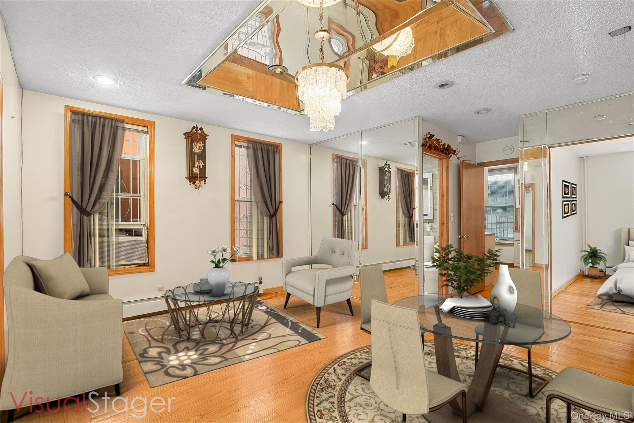 1036 Metcalf Avenue Bronx, NY 10472 - Photo 3 of 26 a living room with furniture a large window and a chandelier