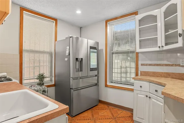 a kitchen with stainless steel appliances a refrigerator and a sink