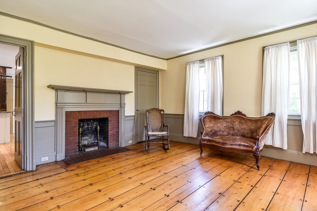 33 Grove Street Framingham, MA 01701 - Photo 2 of 33 a living room with furniture and a fireplace