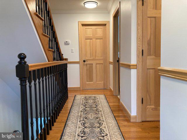38852 Bayfront Drive Ocean View, DE 19970 - Photo 13 of 28 a view of a hallway with wooden floor and staircase