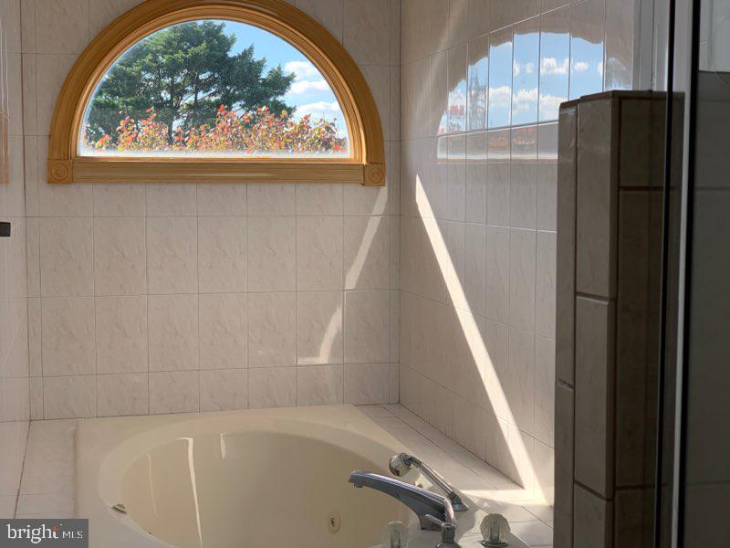 38852 Bayfront Drive Ocean View, DE 19970 - Photo 15 of 28 a view of washer and dryer sitting next to a window