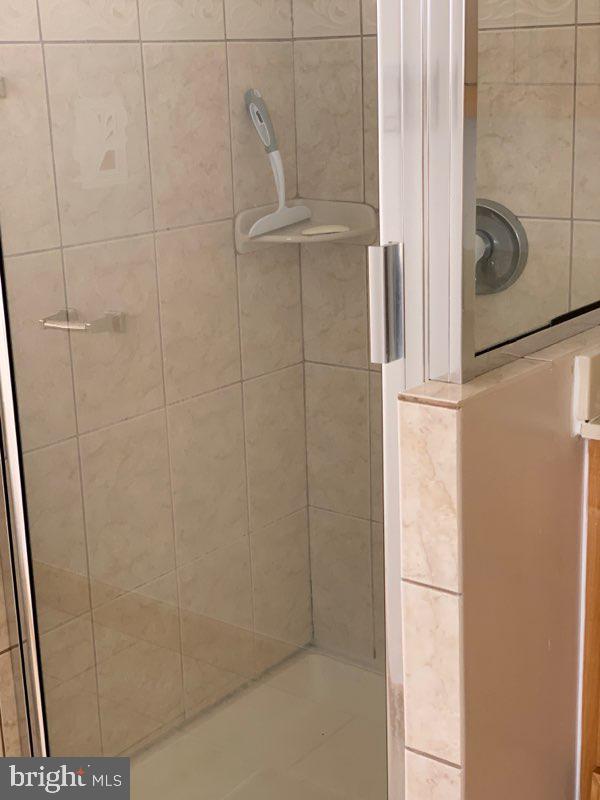 38852 Bayfront Drive Ocean View, DE 19970 - Photo 16 of 28 a bathroom with a shower