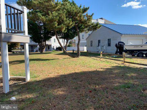 38852 Bayfront Drive Ocean View, DE 19970 - Photo 19 of 28 a view of a house with swimming pool next to a yard