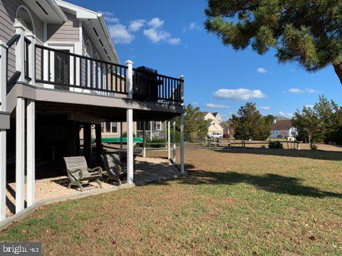 38852 Bayfront Drive Ocean View, DE 19970 - Photo 20 of 28 a view of a house with backyard porch and sitting area