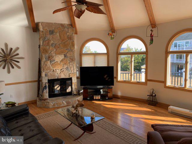 38852 Bayfront Drive Ocean View, DE 19970 - Photo 4 of 28 a living room with fireplace furniture and a flat screen tv