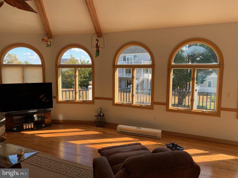 38852 Bayfront Drive Ocean View, DE 19970 - Photo 5 of 28 a bedroom with furniture and a flat screen tv