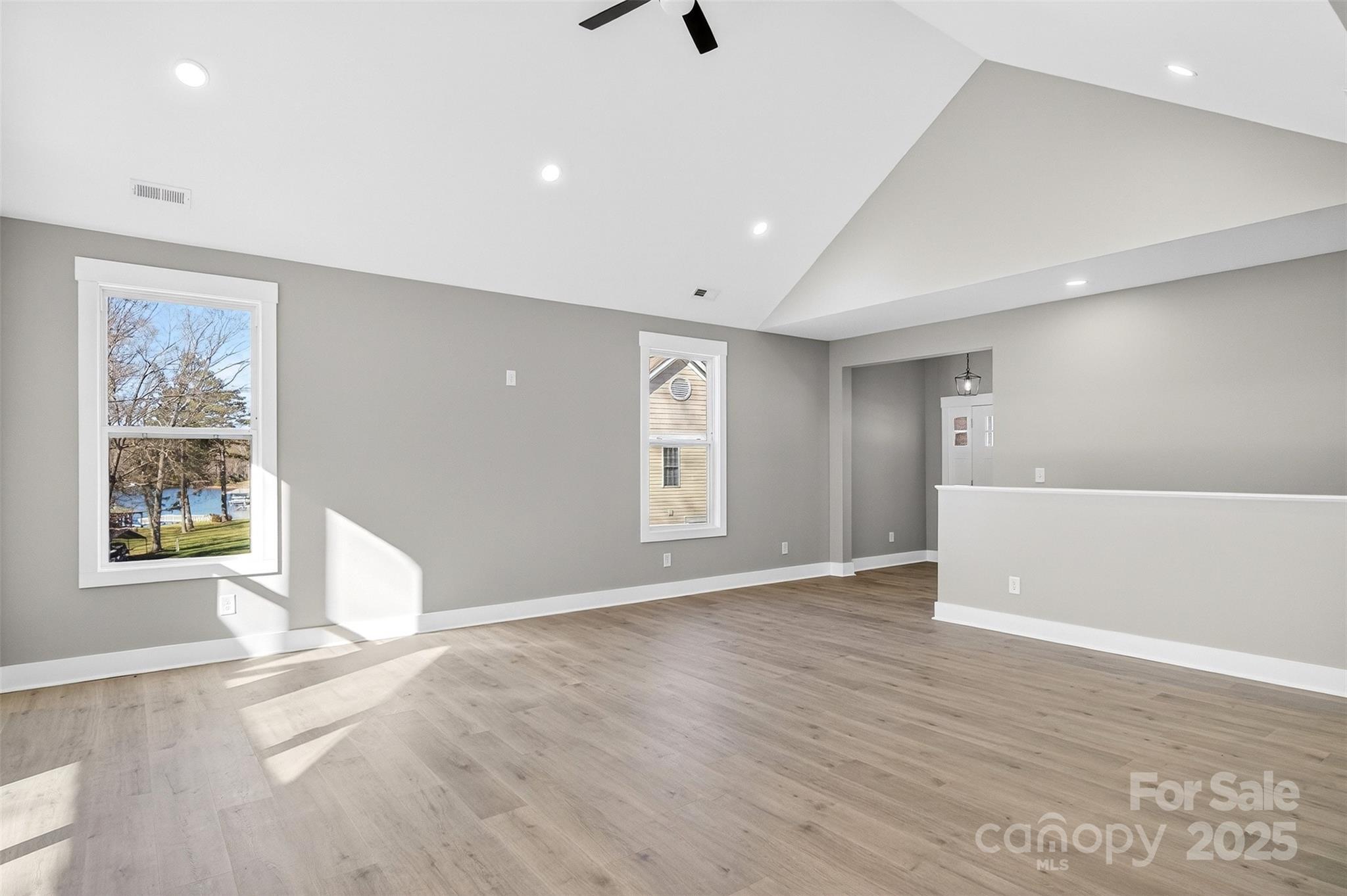 7663 Keistlers Store Road Sherrills Ford, NC 28673 - Photo 14 of 45 a view of an empty room with window and wooden floor