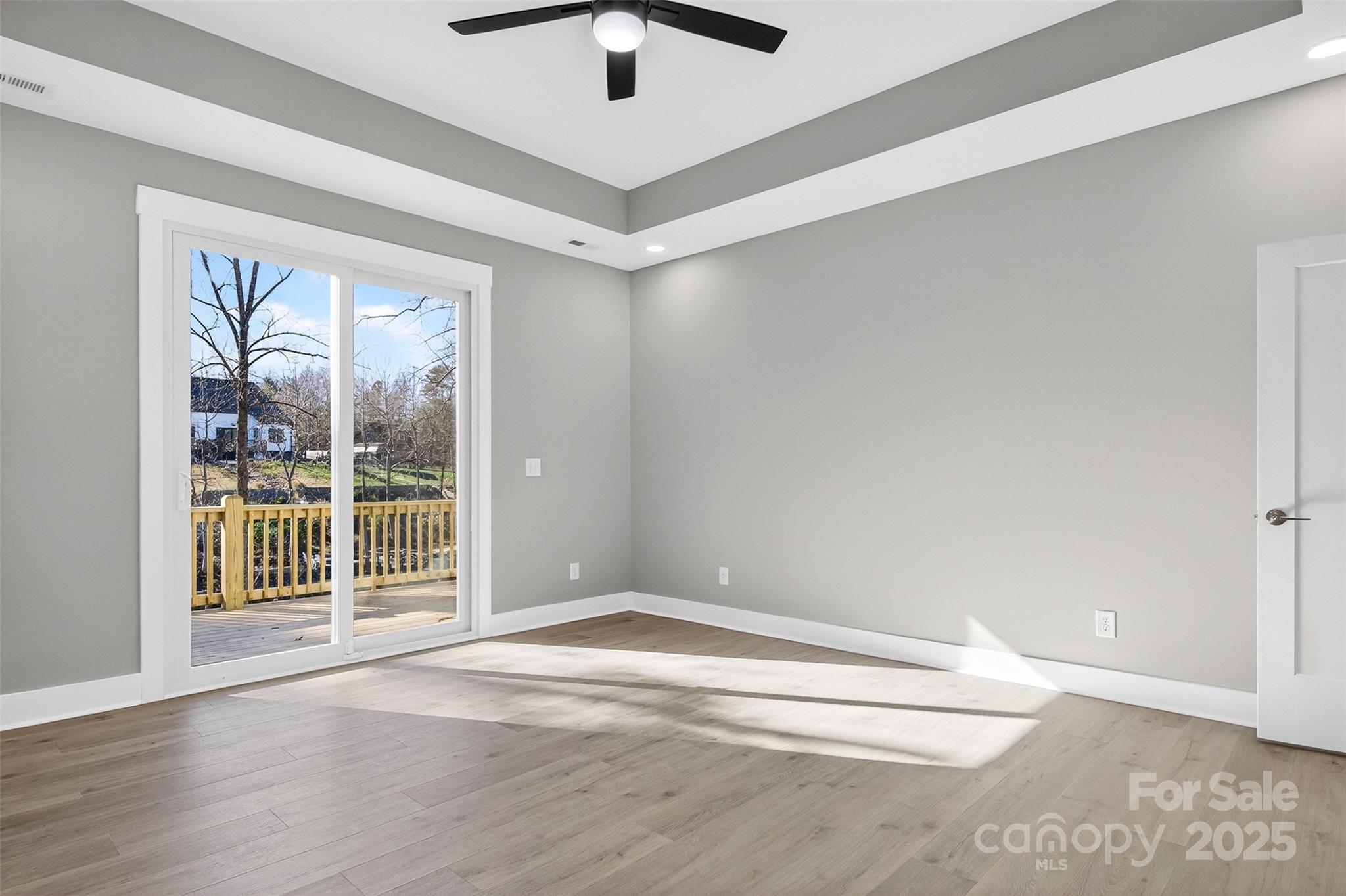 7663 Keistlers Store Road Sherrills Ford, NC 28673 - Photo 16 of 45 an empty room with wooden floor and windows