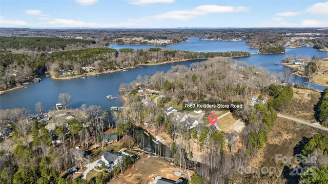 an aerial view of city and lake