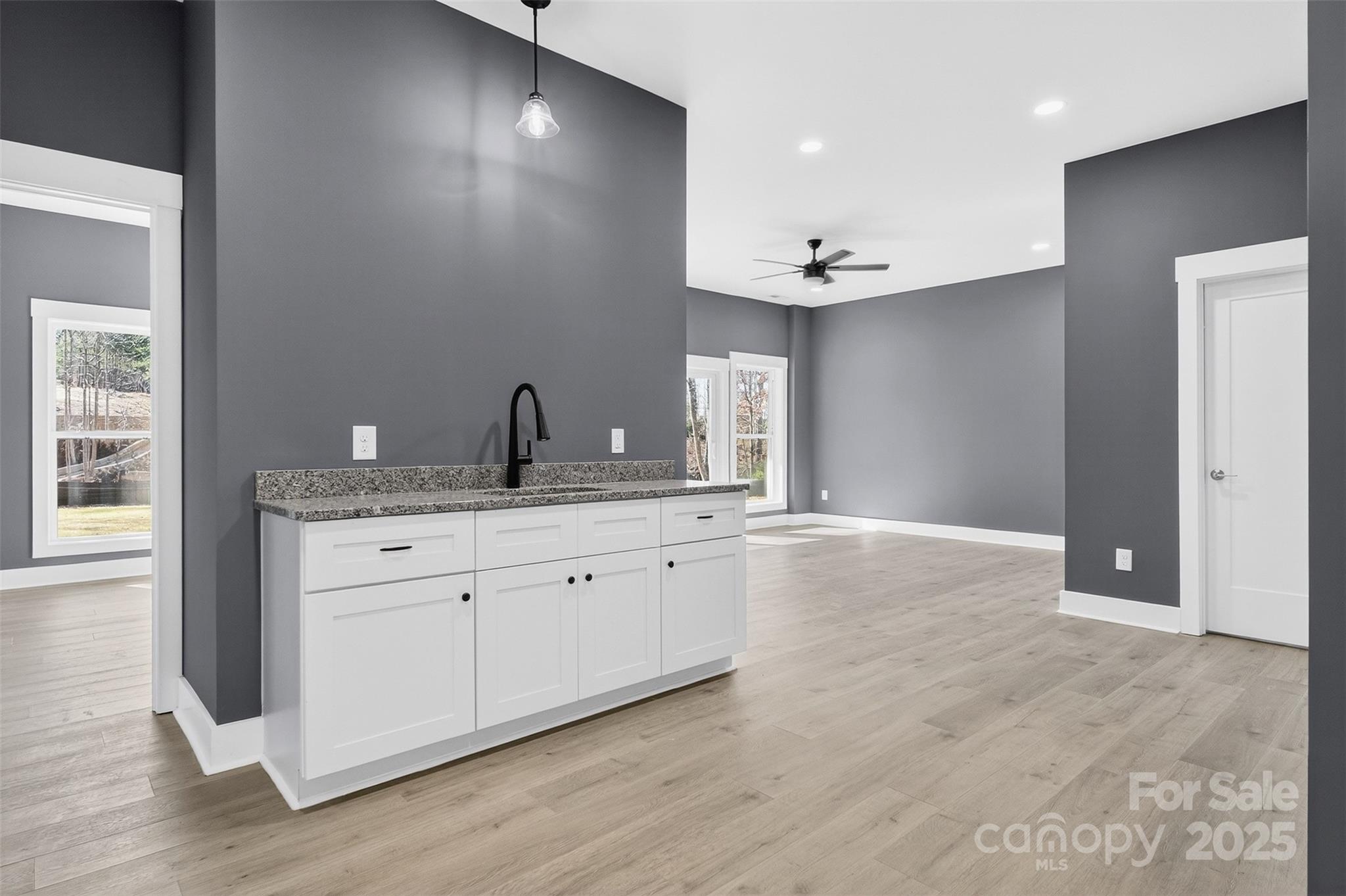 7663 Keistlers Store Road Sherrills Ford, NC 28673 - Photo 22 of 45 a view of a kitchen with granite countertop a sink and dishwasher with wooden floor