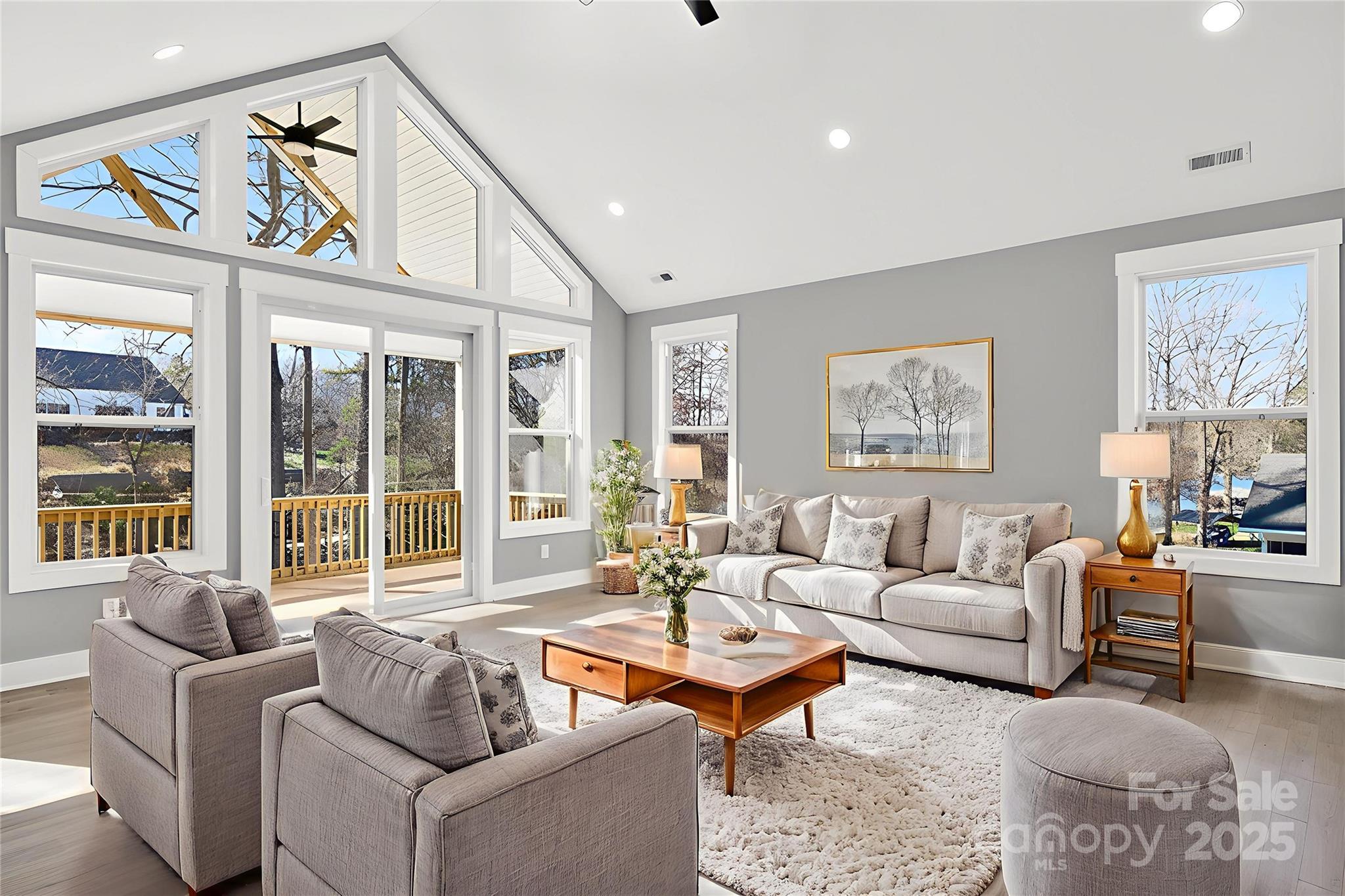 7663 Keistlers Store Road Sherrills Ford, NC 28673 - Photo 30 of 45 a living room with furniture a rug and a large window