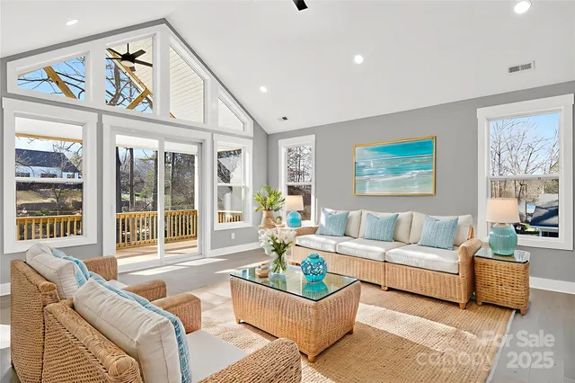 a living room with furniture ceiling fan and a rug