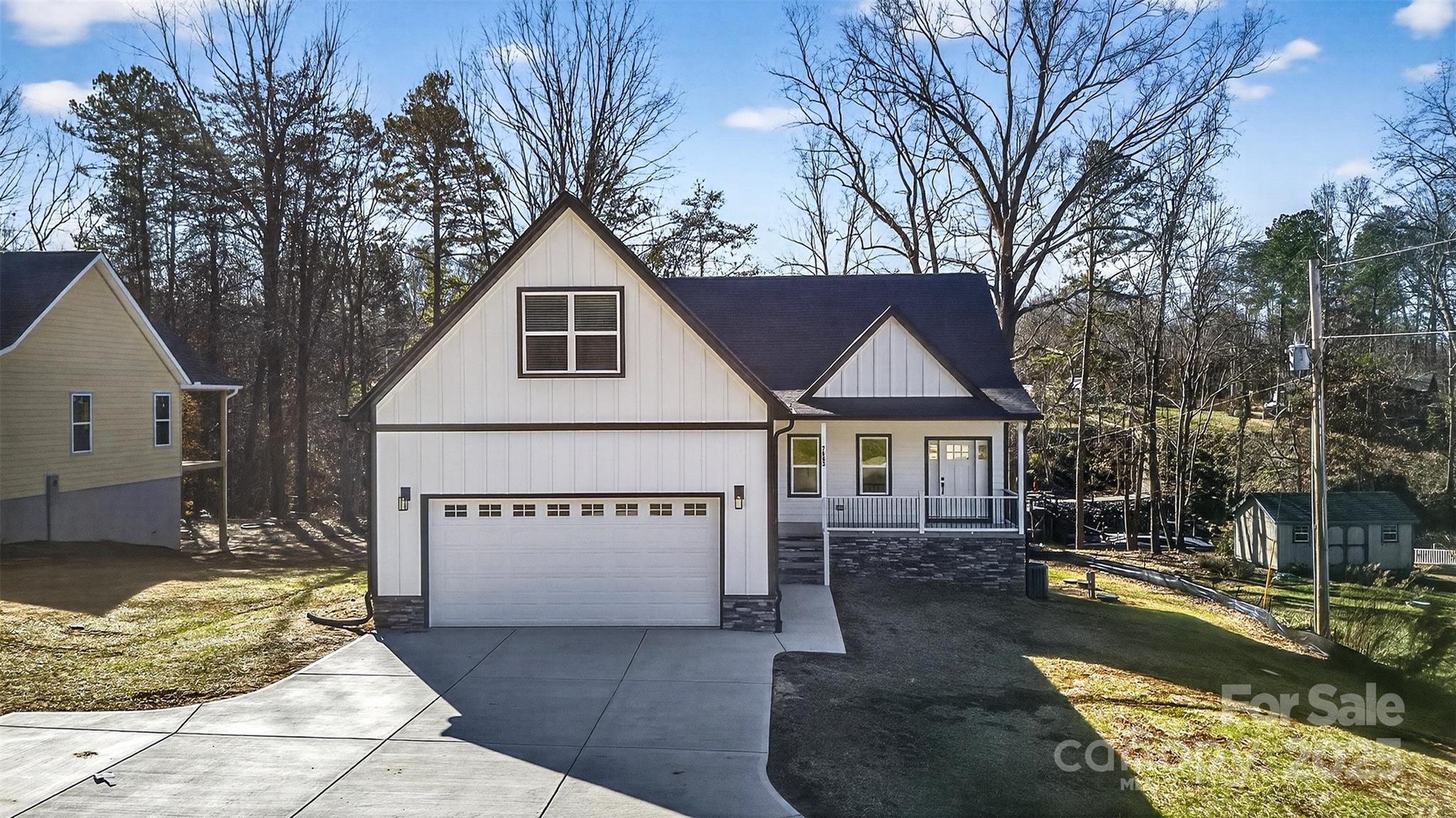 7663 Keistlers Store Road Sherrills Ford, NC 28673 - Photo 4 of 45 a view of a house with a yard covered in snow