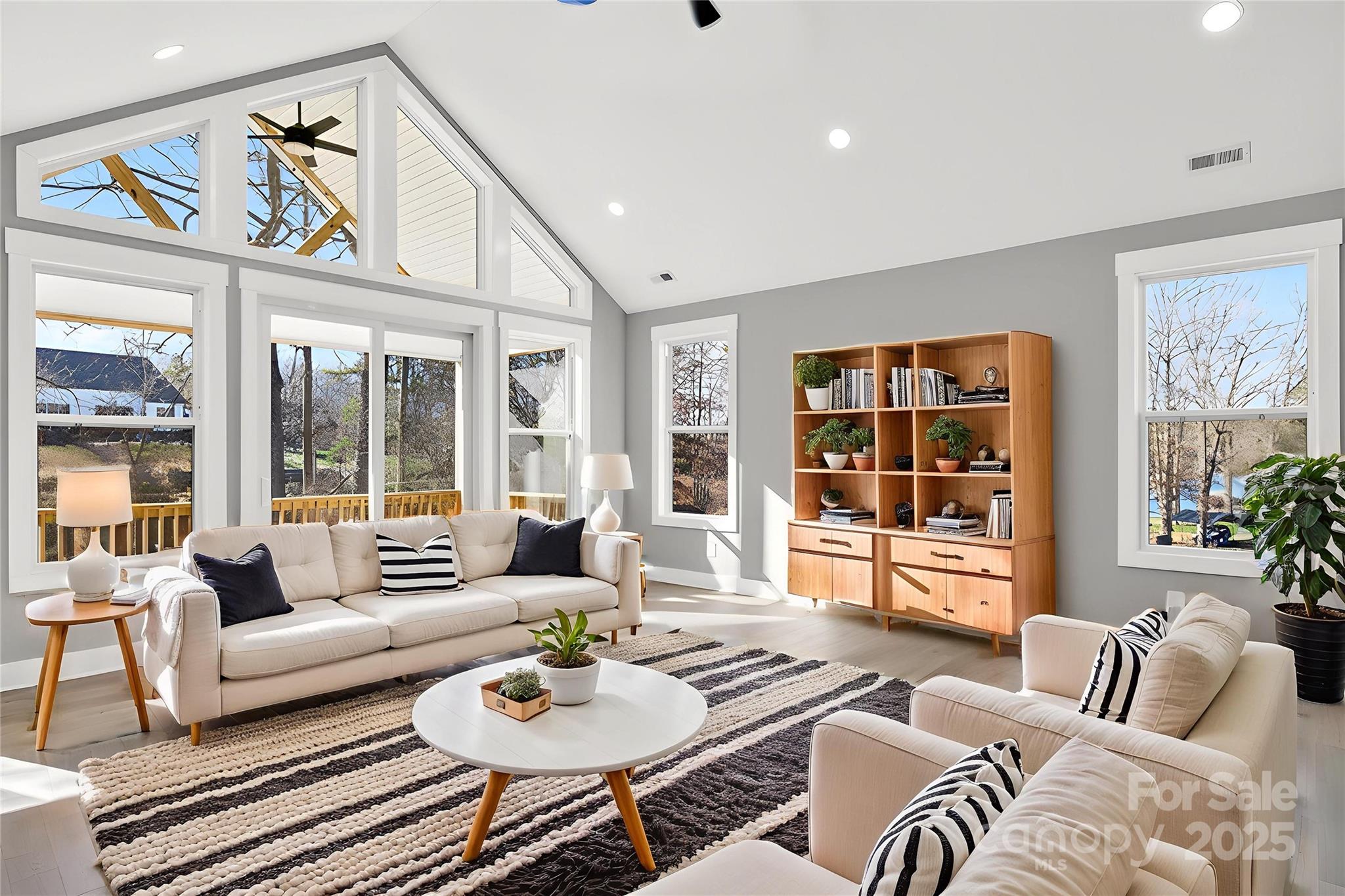 7663 Keistlers Store Road Sherrills Ford, NC 28673 - Photo 5 of 45 a living room with furniture and floor to ceiling windows