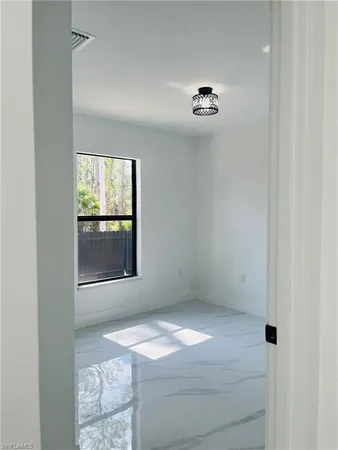 an empty room with windows